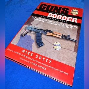 Hardcover book called Guns across the border by mike detty